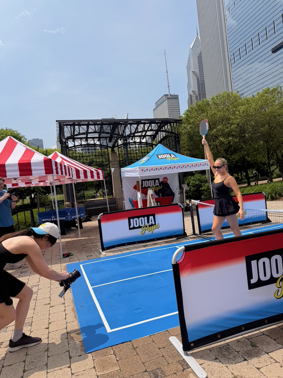 TK on the JOOLA Pops court at the Onze Chicago expansion event, with the Chicago skyline behind her