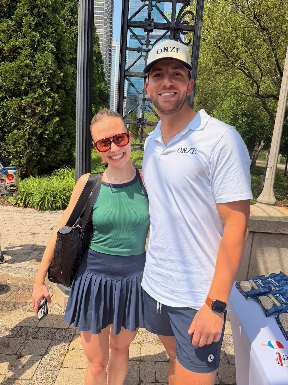Josh Shikoff in Onze gear greeting a guest at the Chicago event